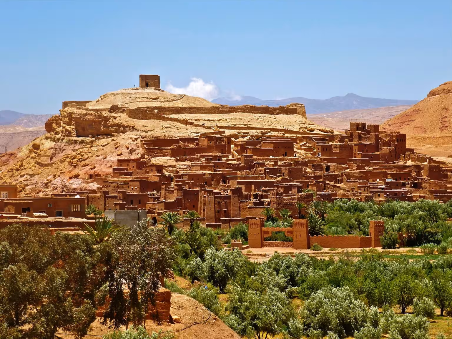 Explore Ait Benhaddou's stunning kasbahs on a 4-day Marrakech to Fez desert tour via Merzouga Erg-Chebbi.