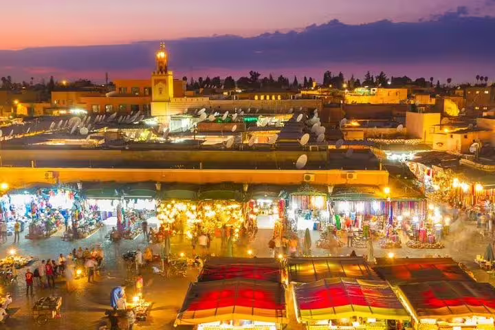 Marrakech Jemaa el-Fnaa night market at sunset, a highlight of Morocco 8-day tour from Tangier