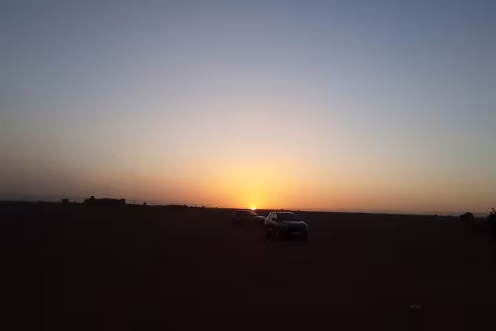 Sunset over Zagora Desert with 4x4 on private 2-day Marrakech to Zagora tour across the Sahara