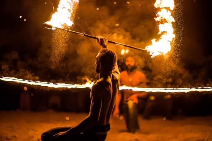 Fire show performer at desert camp during Marsa Alam Jeep safari adventure tour with dinner and show