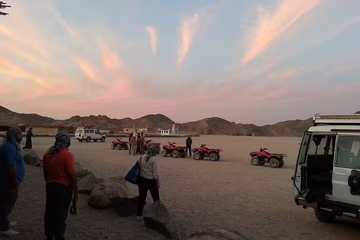 Marsa Alam jeep safari desert stop at sunset with quad bikes and Bedouin guides before dinner show