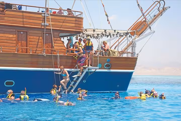 Guests snorkeling from a pirates sailing boat in Marsa Alam, Red Sea, heading to Turtle Bay with pickup