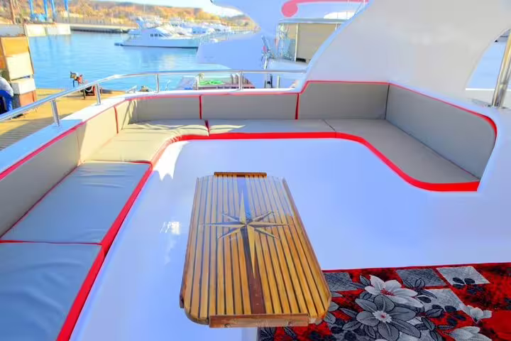 Boat sun deck seating at Marsa Alam marina for Marsa Mubarak snorkeling day trip with dugongs and turtles
