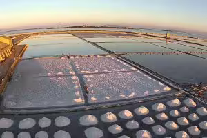Aerial view of Marsala salt pans at sunset, iconic salt mounds on Palermo tour with wine and olive oil tasting
