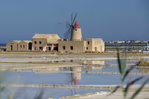 Marsala salt pans with historic windmill, scenic stop on Palermo day trip for salt, wine and olive oil