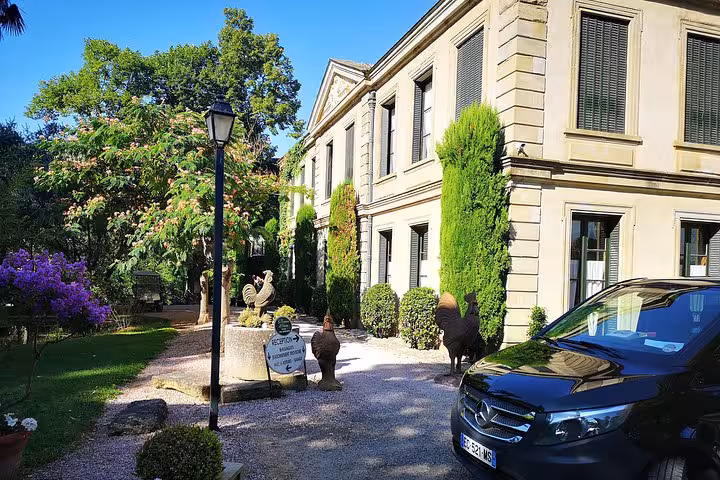 Executive Marseille Airport transfer vehicle at hotel driveway, comfortable private ride to La Grande Motte, Grau du Roi