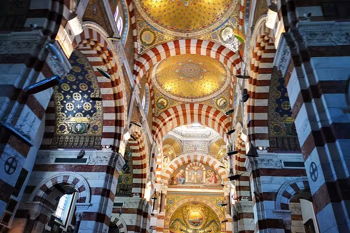 Inside Marseille Cathedral La Major with ornate arches and golden mosaics on a city sightseeing shore tour