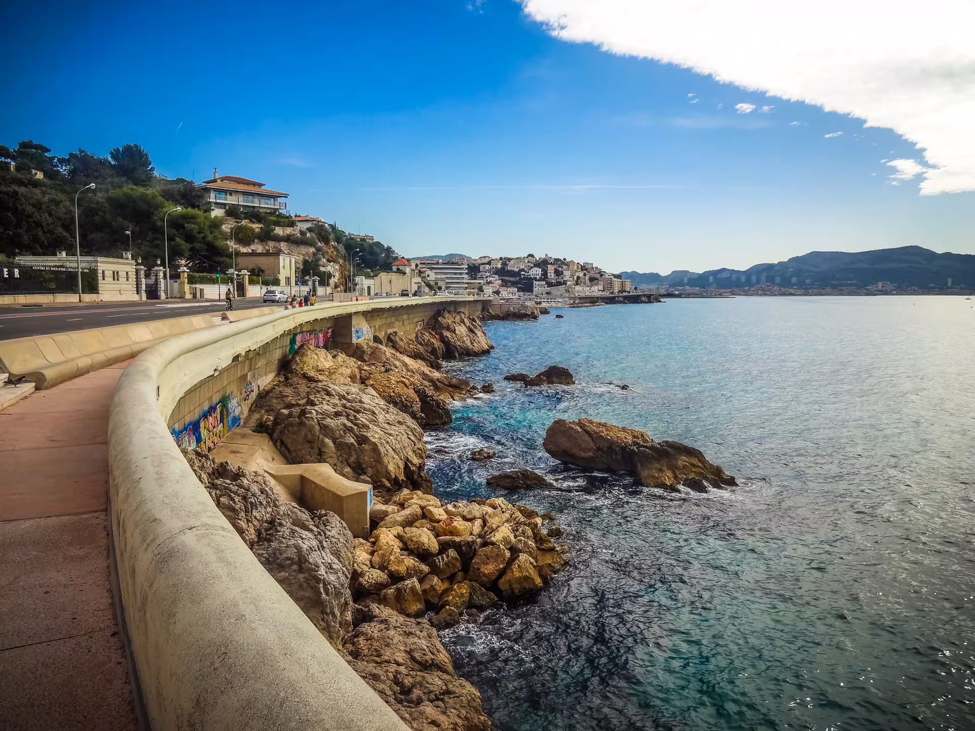Coastal path in Marseille with rocky shoreline and sea views, part of the urban hike from Notre-Dame to the sea