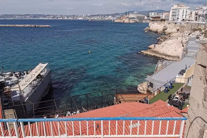 Rocky Marseille coastline with turquoise Mediterranean water near Vallon des Auffes, scenic stop on city tour