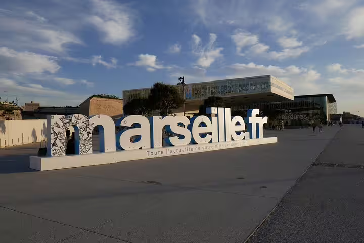 Marseille.fr sign on the Esplanade J4 near MuCEM, a key stop on a self-guided e-scavenger hunt tour