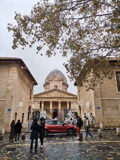 Group arriving at a historic Marseille landmark in the old district, part of a street art, craft and wine tour
