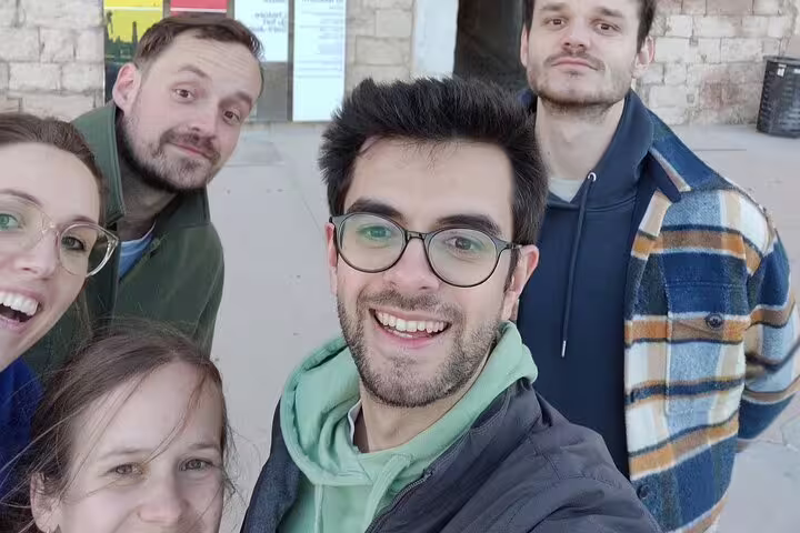 Friends taking a selfie during a Marseille scavenger hunt, enjoying a self-guided walking tour challenge
