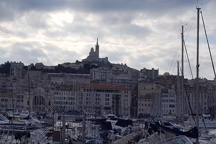 Vieux-Port marina view with Notre-Dame de la Garde on the hill, Marseille shore excursion sightseeing tour