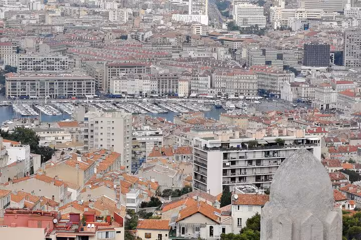 Panoramic view over Marseille rooftops and Vieux-Port marina, a highlight on the Marseille city sightseeing tour