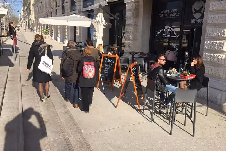 Marseille waterfront café terrace with locals dining, food and city walk stop on a 3-day local tour