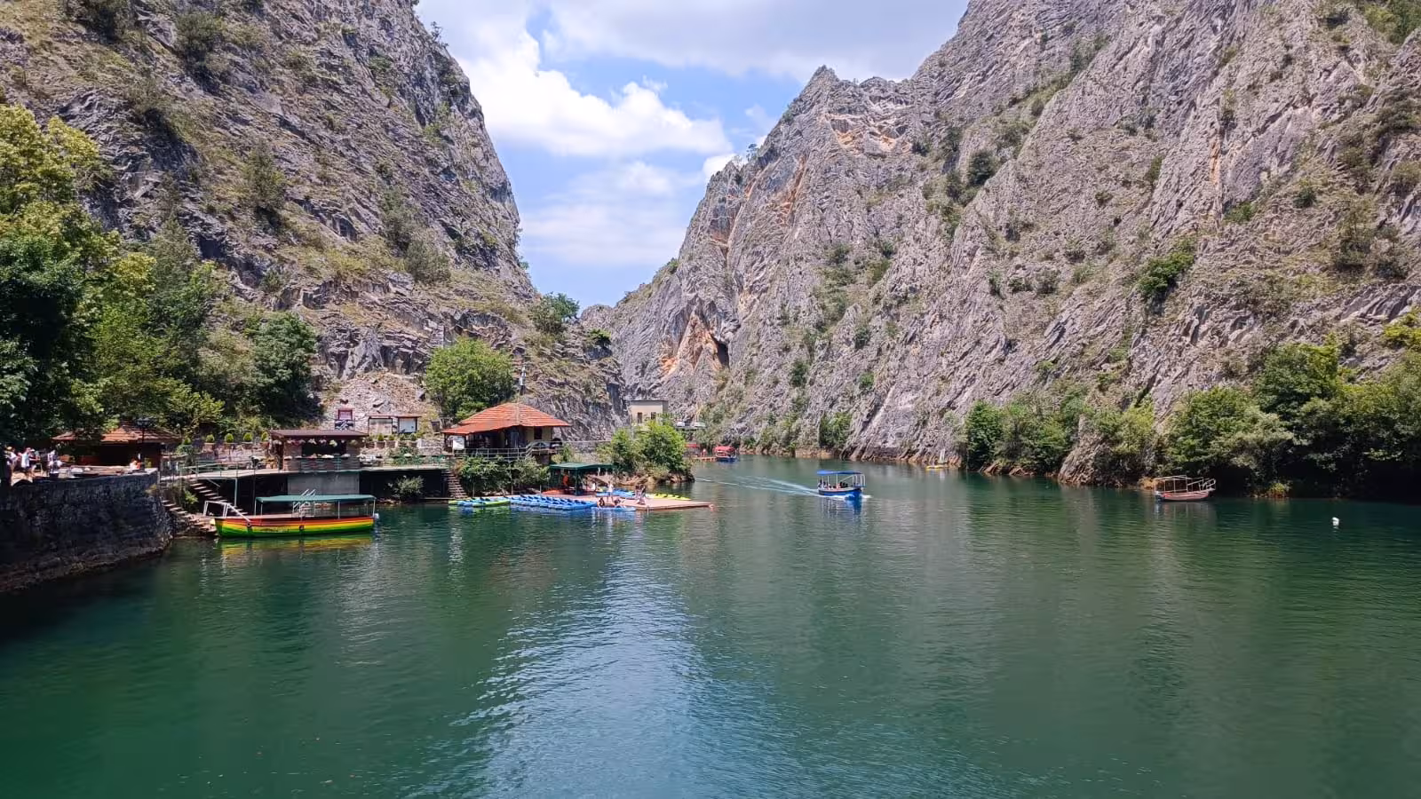 Stunning Matka Canyon with emerald waters and steep cliffs, ideal for exploring during a Balkan experience.