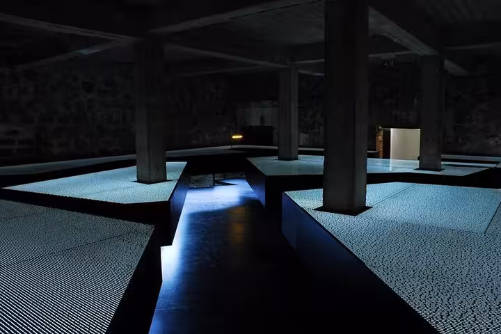 Dim memorial hall at Mauthausen Concentration Camp, a key stop on a private Vienna to Mauthausen day tour