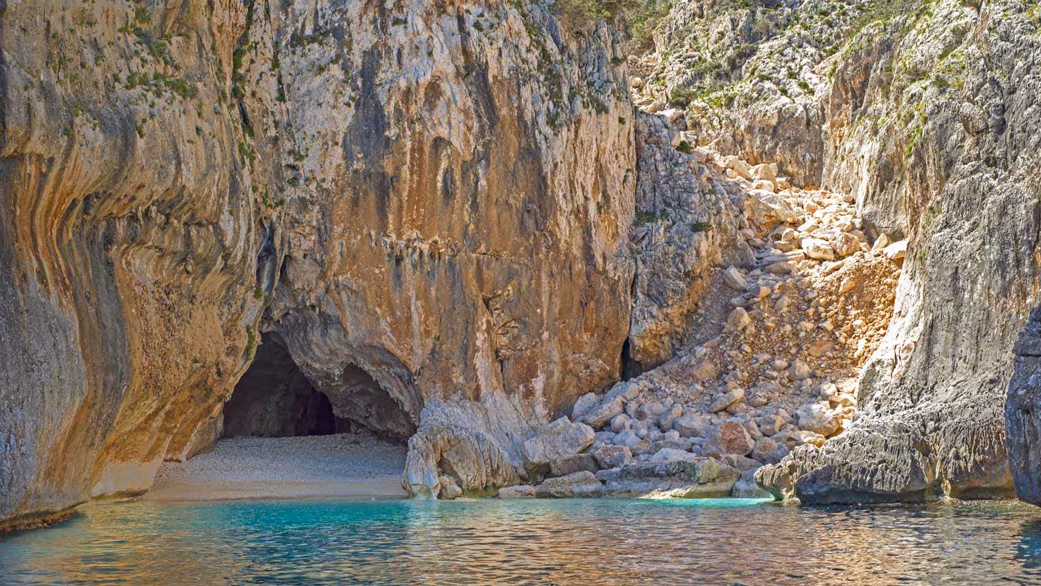 Discover the enchanting coastal cave and pristine beach on a dinghy tour in the Gulf of Orosei from Santa Maria Navarrese.