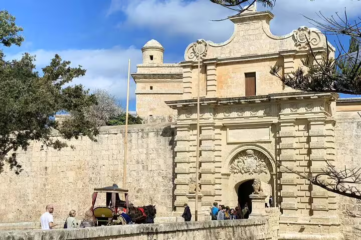 Explore the historic Mdina Gate with guided tours, featuring medieval architecture and horse-drawn carriages.