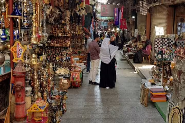 Medieval Cairo bazaar alley with brass lanterns and souvenir stalls on Bazaars Shopping Tour