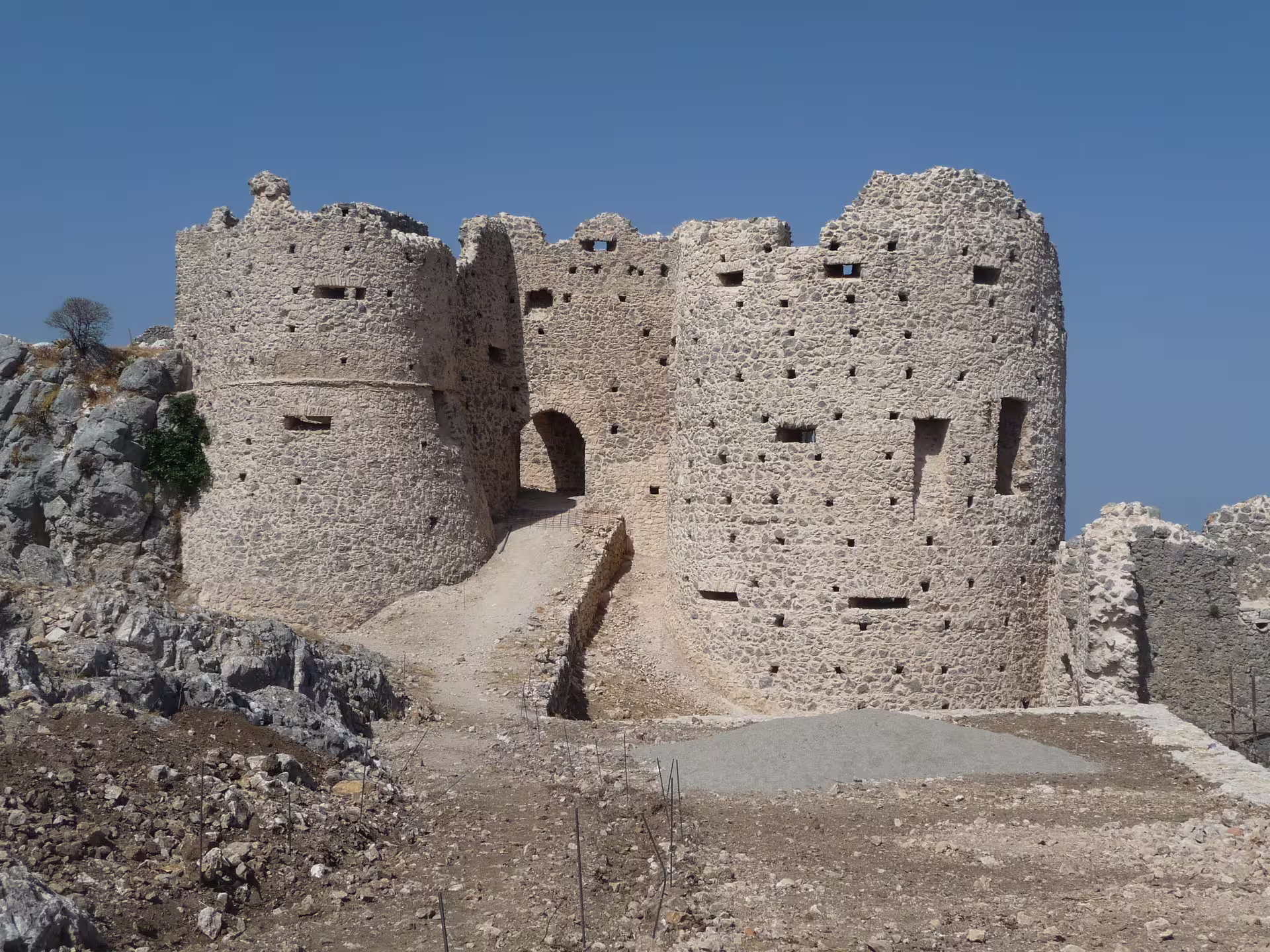 Medieval stone fortress ruins of Stilo in Calabria Jonica under a clear blue sky, featured on the Stilo and Gerace tour