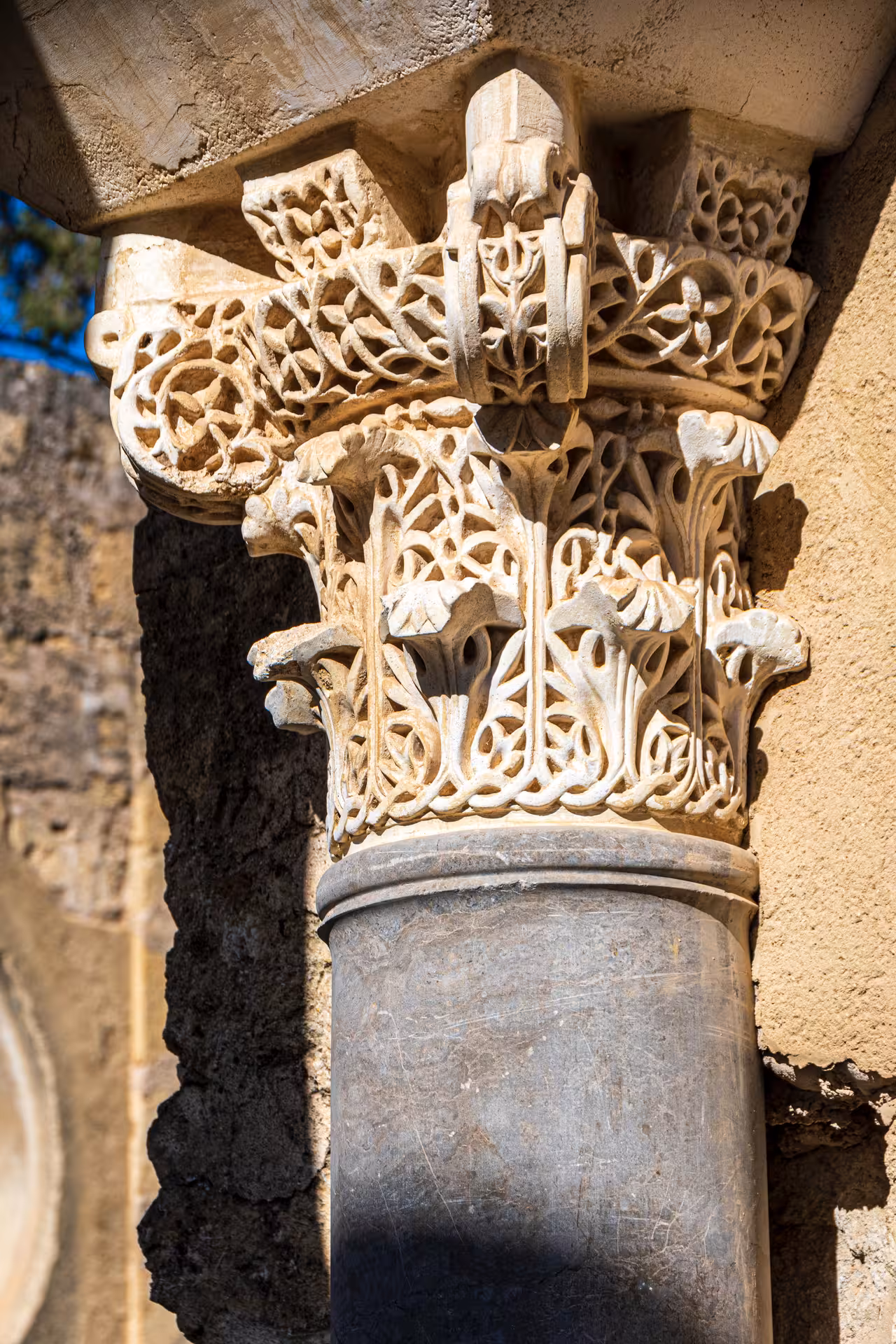 Ornate stone column at Medina Azahara, highlighting the exquisite craftsmanship on guided tours from Córdoba.