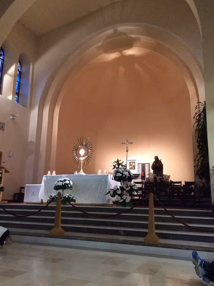 Medjugorje church altar with Eucharistic monstrance and flowers, spiritual day trip from Split