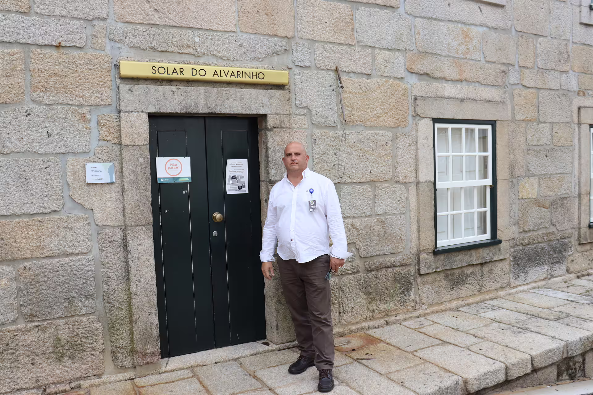 Man standing in front of Solar do Alvarinho entrance in Melgaço, highlighting a private tour in Portugal's Alvarinho wine region.