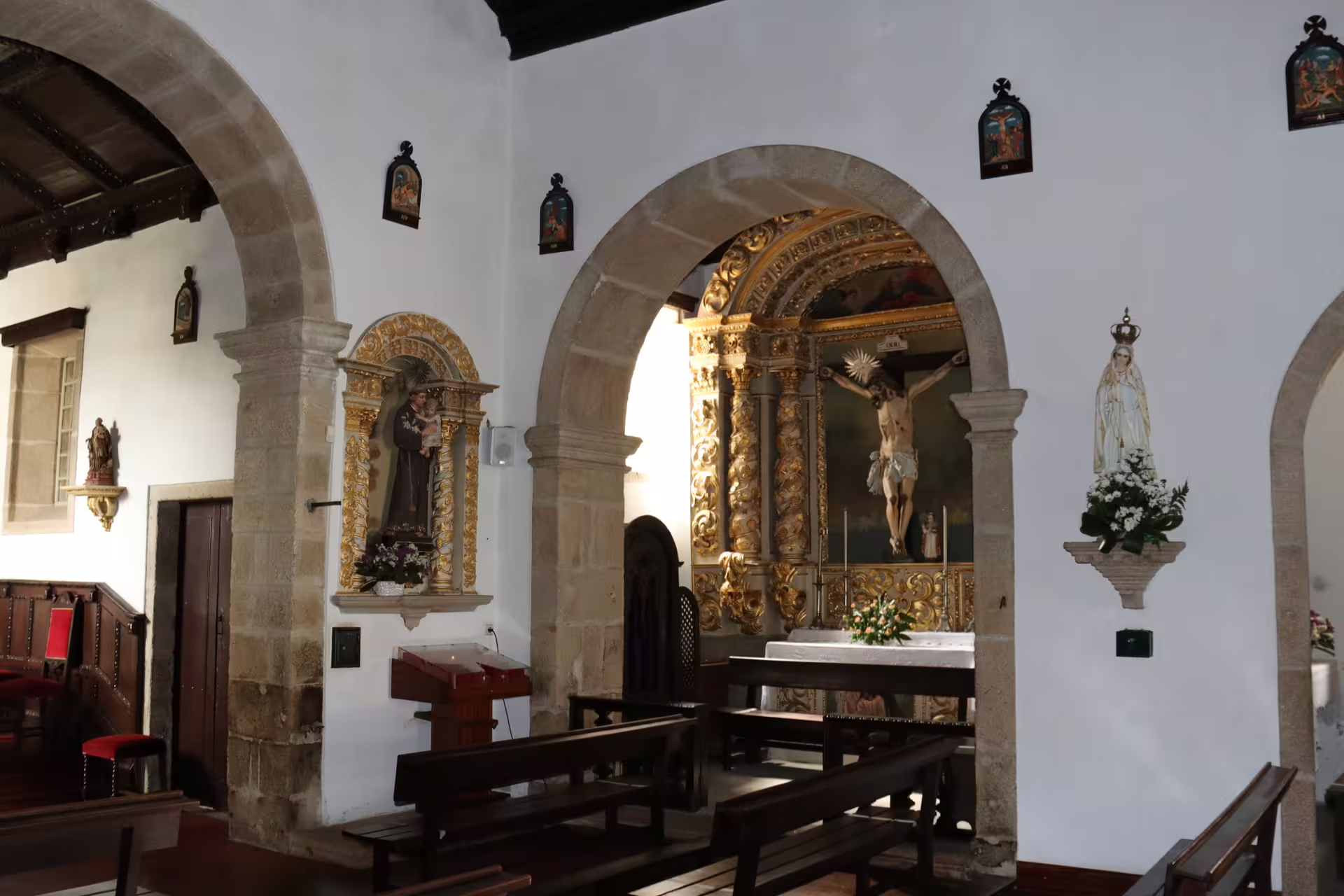 Historic church interior in Melgaço with ornate altar, showcasing cultural heritage on a private Alvarinho wine tour.