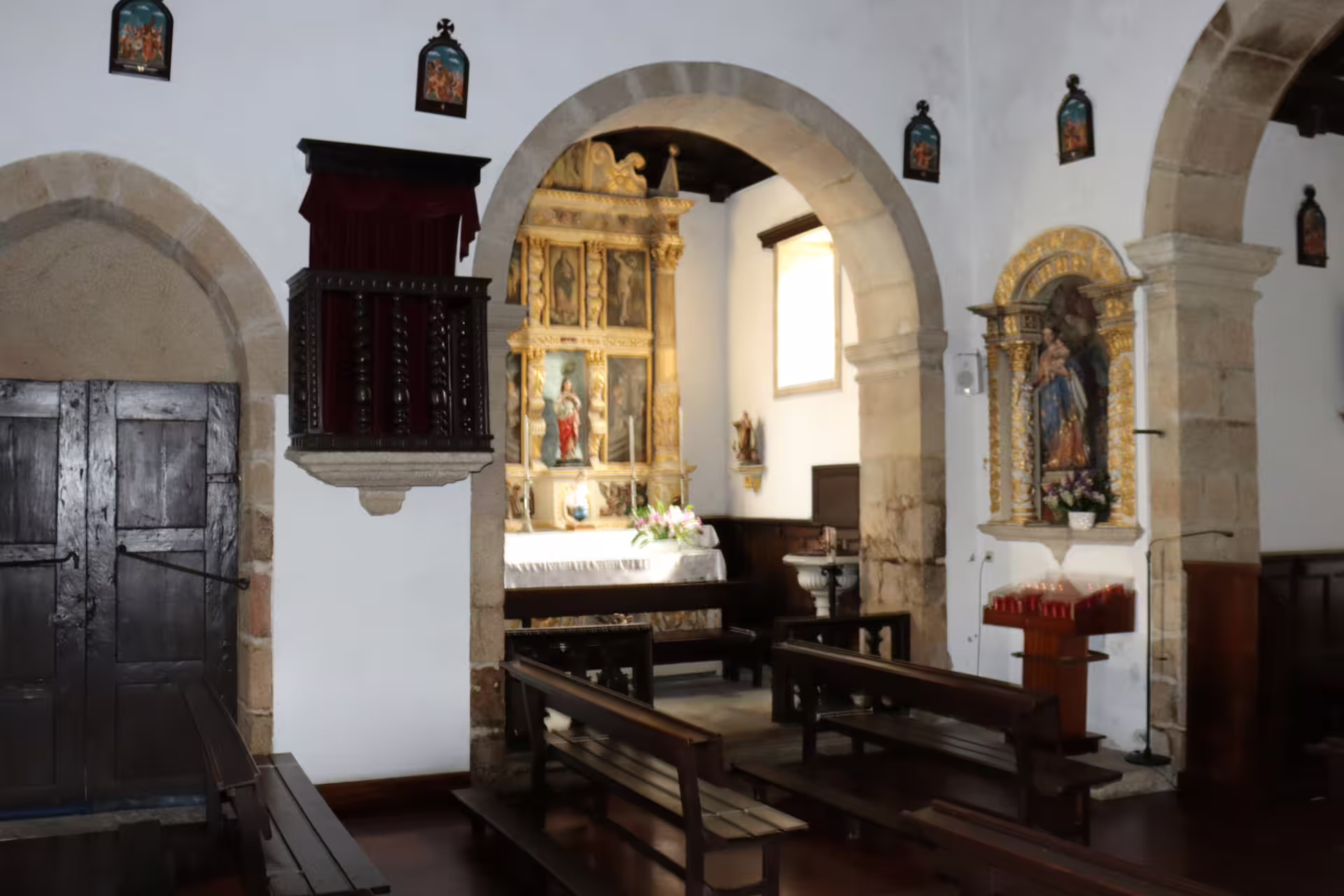 Historic church interior in Melgaço, showcasing intricate religious art, part of the Private Tour to the Alvarinho wine region.