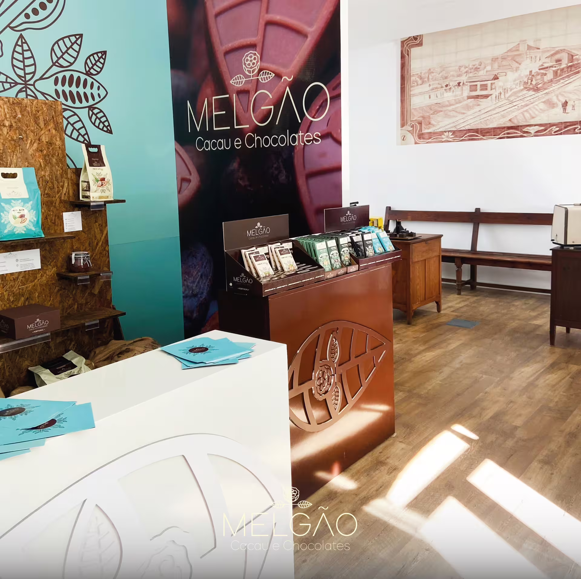 Interior view of Melgão chocolate factory shop with vibrant displays and packaged chocolates in Évora.