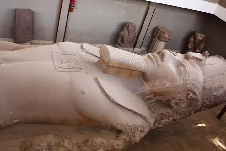 Memphis open-air museum colossal statue of Ramses II on Cairo layover tour to pyramids and Sakkara