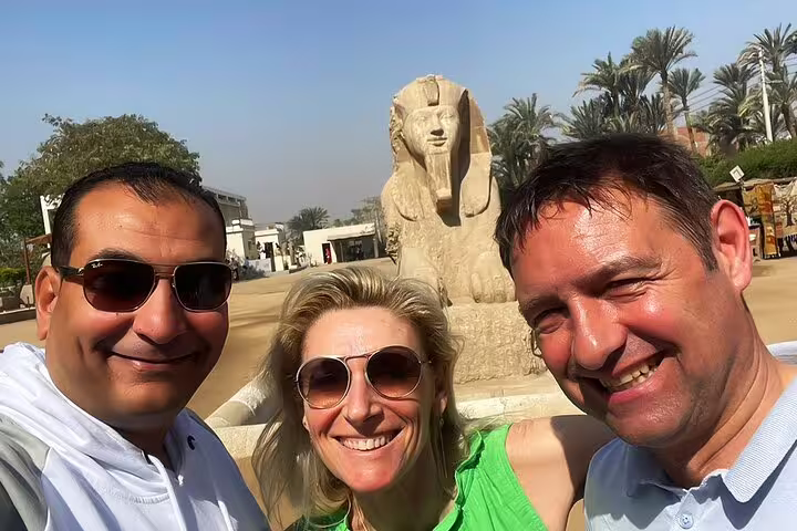 Group selfie at Memphis open-air museum with Egyptian sphinx statue, Sakkara and Memphis tour near Cairo