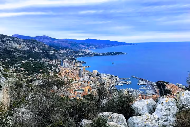 Panoramic view of Menton's coastline with vibrant cityscape and azure sea, perfect for a breathtaking private tour.
