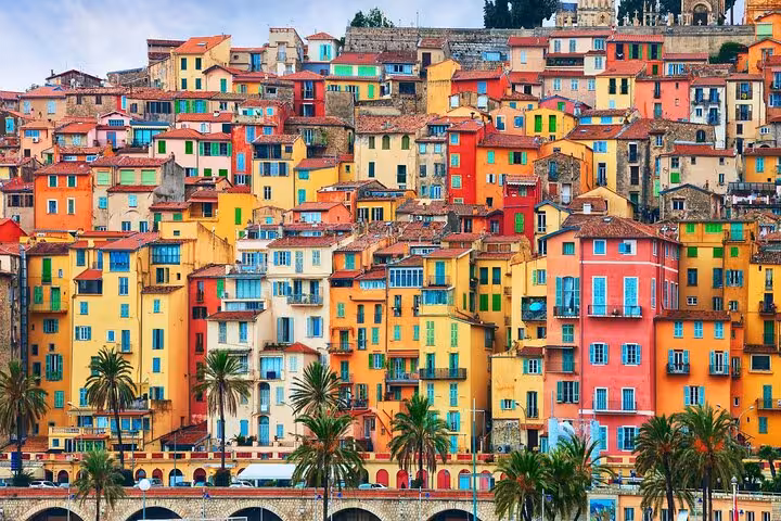 Colorful hillside buildings in Menton, French Riviera, ideal for a vibrant day trip tour.
