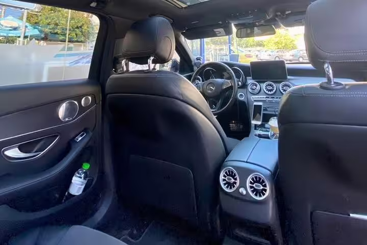 Premium Mercedes interior with leather seats for meet and greet airport transfer, comfortable private ride