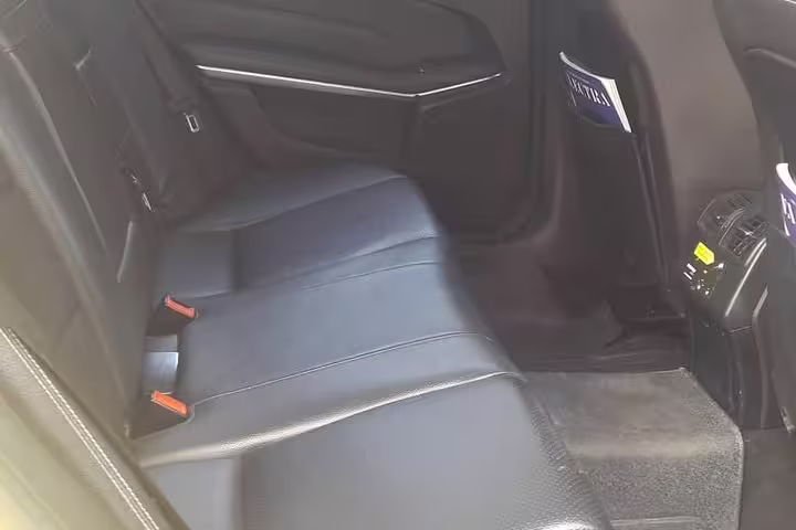 Spacious leather rear seats in Mercedes for Porto Heli Amanzoe to Athens private transfer with Wi-Fi