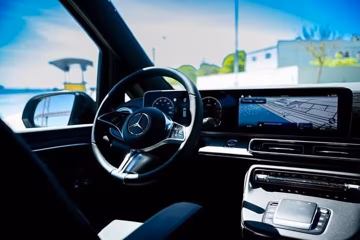 Modern Mercedes interior with advanced navigation system for seamless Lisbon to Porto private transfer.