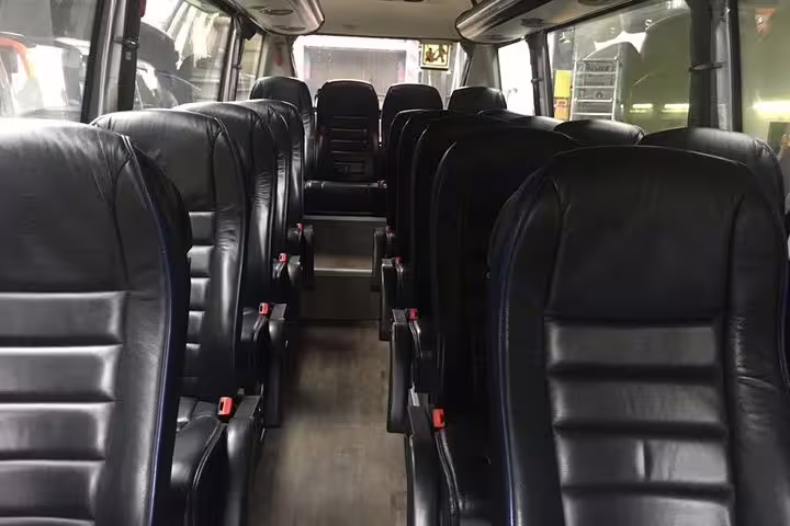 Spacious interior of a Mercedes minibus with leather seating, perfect for comfortable group transfers in Barcelona.