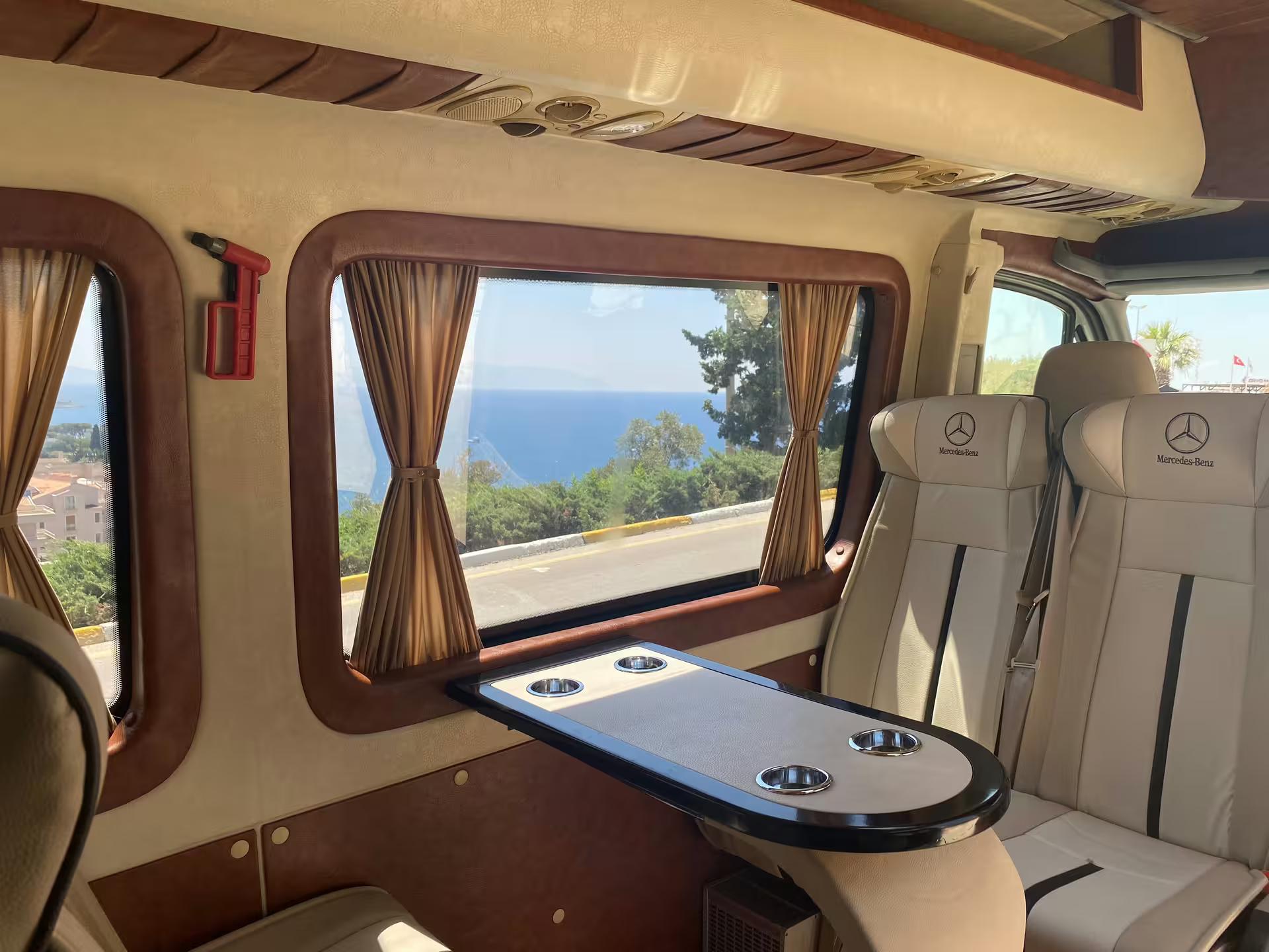 Comfortable Mercedes minibus interior with sea view, small group Seven Churches of Revelation tour Turkey