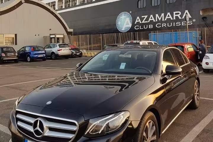 Elegant Mercedes sedan parked at Civitavecchia Port for comfortable transfer to Rome.