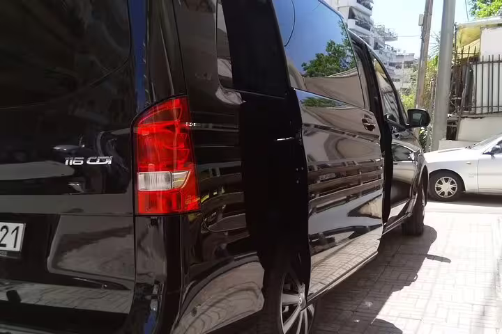 Black Mercedes van with sliding door open for Athens city centre to Athens International Airport transfer service