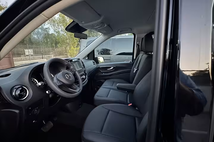 Front seat interior of Mercedes van, highlighting comfort and elegance for private Rome to Amalfi Coast journey.