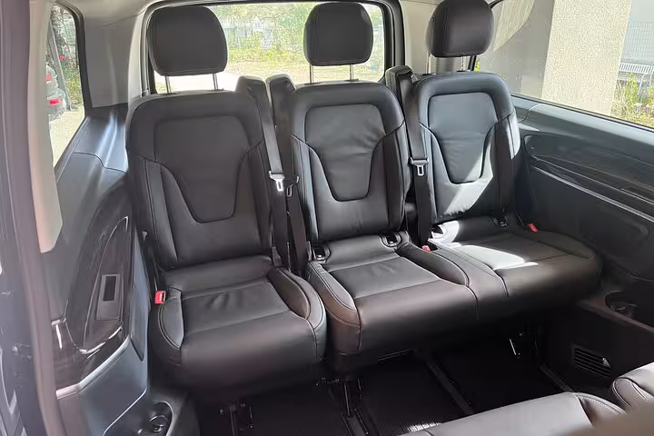 Comfortable leather seating inside a Mercedes van ideal for Milan MXP airport to city transfers.