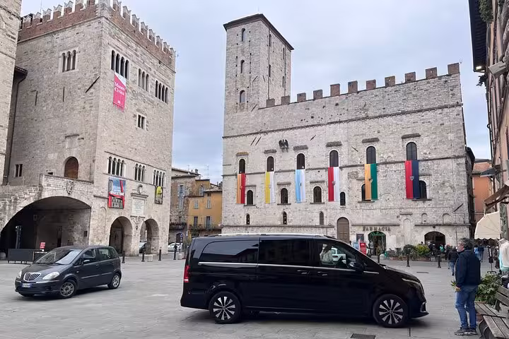 Elegant Mercedes van parked in historic Milan square, perfect for Milan MXP airport to city center transfers.