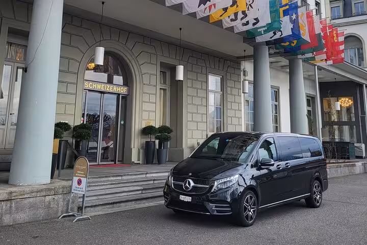 Luxury Mercedes van parked in front of the Schweizerhof hotel, ready for the Rhine Falls & Stein am Rhein tour.