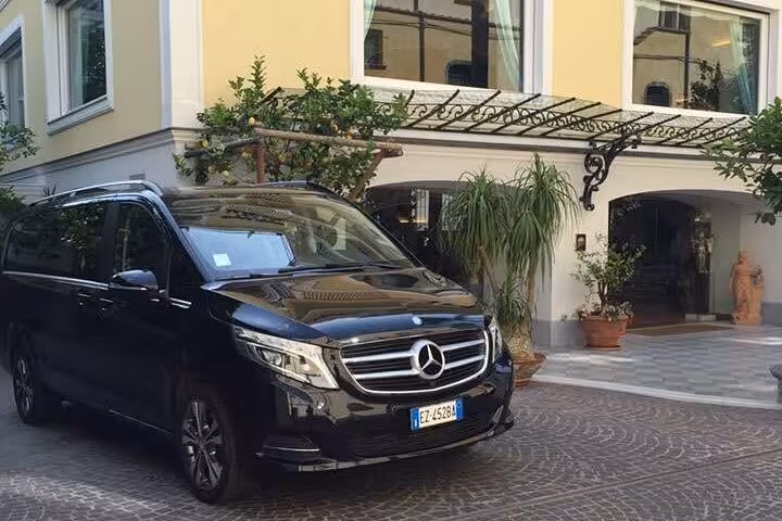 Black Mercedes van ready for private day tours from Sorrento to the scenic Amalfi Coast.
