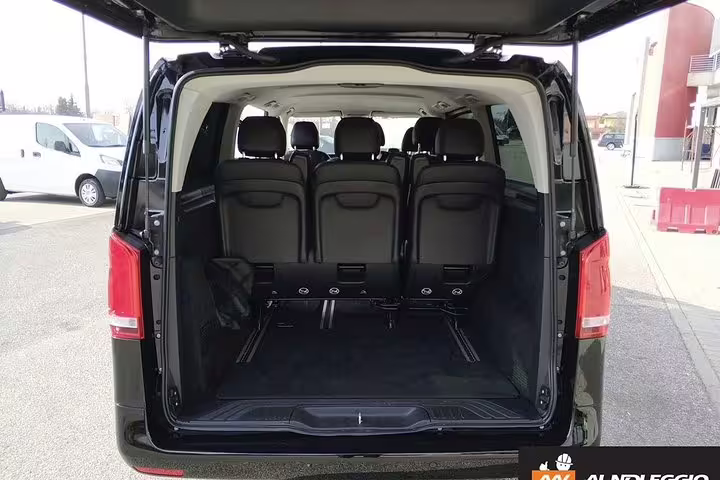 Spacious Mercedes van trunk ready for luggage on private chauffeur transfer to The Mall and Prada Outlet Space