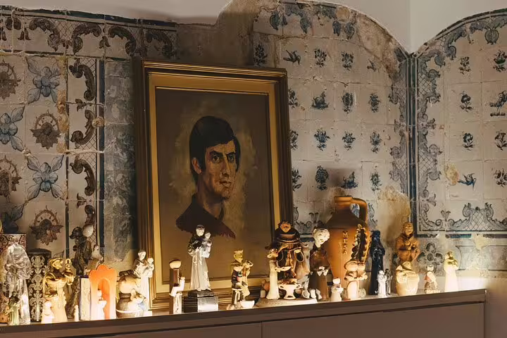 Traditional Portuguese decor at Mesa de Frades, featuring vintage tiles and cultural artifacts in Lisbon.