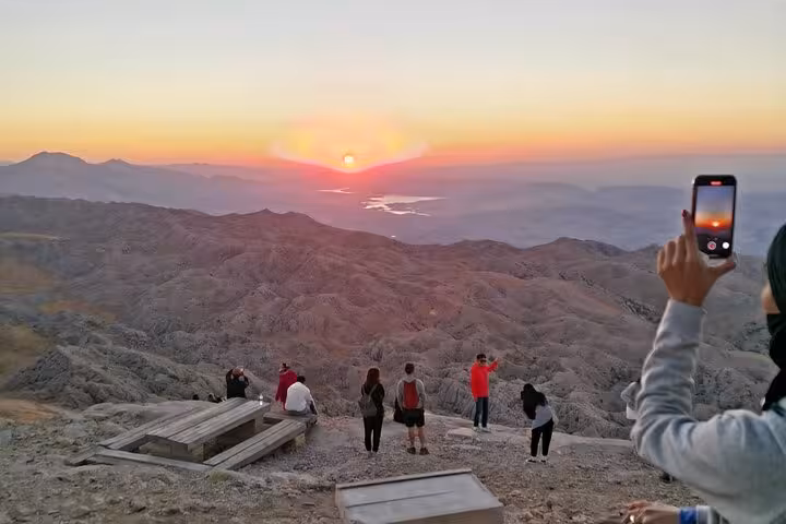 Sunrise viewpoint in Mesopotamia, Turkey, travelers watching dawn over rugged mountains on a private 9-day tour